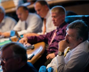 The Rev. Timothy Yeadon, right, president of the New England District, listens to a presentation during the Sept. 20-23 LCMS Council Of Presidents meeting at the Synod’s International Center in St. Louis. (LCMS/Erik M. Lunsford)