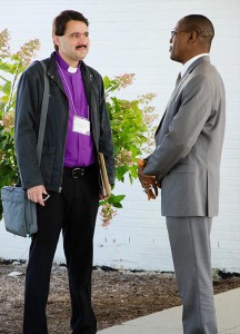 Bishop Vsevelod Lytkin, left, of Siberia and Bishop Dean Johannes Mafereka (South Africa) visit between sessions of the Sept. 23-26 LCMS International Disaster Conference in Fort Wayne, Ind. (LCMS/Pamela J. Nielsen)