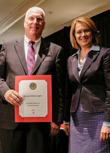 The Rev. Bill Engfehr poses with his Red Cross Community Preparedness and Resiliency Award, presented Sept. 23 in Clayton, Mo. At right is Cindy Erikson, regional CEO for St. Louis with the American Red Cross.