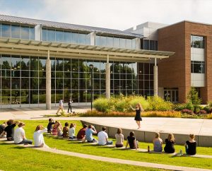 A speaker addresses a class outside the George R. White Library and Learning Center at Concordia University Portland July 11 in Portland, Ore. The university saw its enrollment grow by 37 percent this fall, largely because of its online graduate programs in education. (LCMS/Erik M. Lunsford)