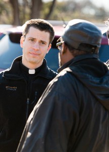 The Rev. Mark Koschmann listens as a man shares his concerns in Ferguson, Mo. Koschmann, assistant pastor at Chapel of the Cross Lutheran Church, St. Louis, said being among the protesters "definitely opened my eyes to their frustration" and he believes the anger "is larger than one incident — it's just a symptom of some real deep hurt and rawness" related to feelings of racism. (LCMS/Erik M. Lunsford)