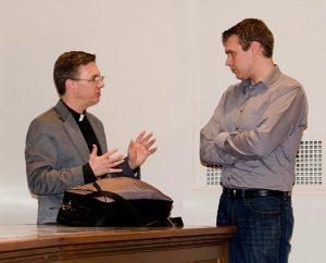 The Rev. Christopher S. Esget, left, pastor of Immanuel Evangelical Lutheran Church, Alexandria, Va., talks with Merritt Demski, a vicar at Immanuel Lutheran Church in Waterloo, Ill., following Esget’s presentation on pastoral care during the Infertility Ethics Symposium Nov. 8 at Concordia Seminary, St. Louis. (LCMS/Melanie Ave)