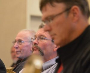 The Rev. Terry Forke, president of the LCMS Montana District, second from right, listens to presentations at the recent LCMS Rural and Small-Town Mission conference, held in Kansas City, Mo. (LCMS/Adriane Heins)