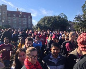 Students and others gather on the campus of Florida State University (FSU), Tallahassee, after an early-morning shooting in the school's library on Nov. 20. The Rev. Jay Winters, pastor of University Lutheran Church and Student Center on the FSU campus, is at left (in blue shirt, with dark vest), talking to a man (in dark jacket) whose back is to the camera. 