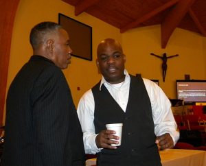 The Rev. Greg Manning of New Orleans, right, and LCMS Black Clergy Caucus President Rev. Byron Williams Sr. visit during a break at the Jan. 14-16 caucus gathering in Dallas. Williams is pastor of St. Paul Lutheran Church, where the gathering took place. (LCMS/Joe Isenhower Jr.)