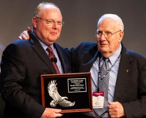 Harlan “Hal” Chase (right) accepts the Arthur C. Haake Leadership Award from LCEF President/CEO Rich Robertson. Chase was honored for his years of outstanding service to LCEF and the congregations he served as an LCEF Capital Funding Services consultant. (Lutheran Church Extension Fund)