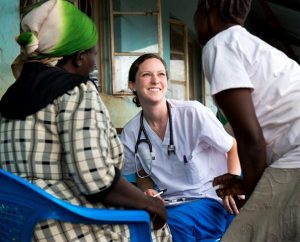 Madison McKinney, a member of Holy Trinity Lutheran Church in Statesville, N.C., talks to villagers during a Mercy Medical Team (MMT) trip to Kenya in June 2014. College students studying for health-care careers may apply for grants that will pay all or most of the cost to take part in an MMT trip. (LCMS/Erik M. Lunsford)