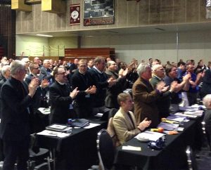 Participants in 2015 LCMS Northern Illinois District convention — March 6-7 at River Forest, Ill. — applaud after LCMS President Rev. Dr. Matthew C. Harrison and Lutheran Church in Norway Acting Bishop Rev. Torkild Masvie sign protocol documents for church fellowship between their two church bodies. (Jon Vieker)