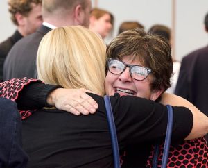 Missionary Susan Dorn, right, hugs her friend Sue Guzek during a reception following the March 13 "Sending Service." Dorn, who has accepted a call to serve in Latin America, says that in spite of the "sacrifice" of leaving her stateside family, she's excited about her new "adventure." (LCMS/Frank Kohn)