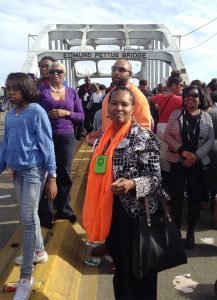 Etta Watts, center, a member of Pilgrim Lutheran Church, Washington, D.C., joins marchers March 8 crossing the Edmund Pettus Bridge in Selma, Ala., during the 50th anniversary of the Voting Rights Movement led by the Rev. Dr. Martin Luther King Jr. (Courtesy of Etta Watts)