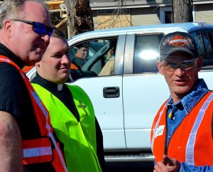 Rochelle, Ill., resident Robert Challand discusses the tornado’s aftermath with the Rev. Michael Meyer, disaster response manager for the LCMS Office of National Mission (ONM), and the Rev. Greg Hoffmann, pastor of St. Paul Lutheran Church and School, Rochelle, Ill., April 11. (LCMS/Al Dowbnia) 