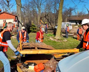 Volunteers work to clear debris in the aftermath of the tornado that struck Northern Illinois April 9. (LCMS/Al Dowbnia)