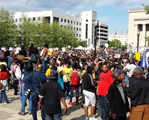 People gather for a peaceful rally in front of Baltimore's city hall May 2 — a week after the violent protests triggered by the death of Freddie Gray, who was injured and died while in police custody. (Tina Jasion)