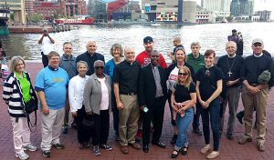 LCMS Southeastern District (SED) "prayer walkers" pose for a group photo along Baltimore's Inner Harbor. Members of the group — who took part in a city rally and march May 2 — represented nine SED congregations and staff from LINC Baltimore. (Tina Jasion) 