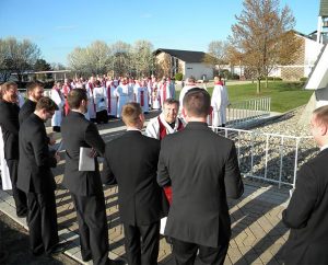 LCMS New England District President Rev. Timothy Yeadon greets several Concordia Theological Seminary, Fort Wayne, students April 28 before they receive their pastoral calls during a service in the seminary chapel. (LCMS/Joe Isenhower Jr.)