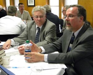 The Rev. Dr. Paul J. Grime (right), dean of Spiritual Formation and the Chapel at Concordia Theological Seminary, Fort Wayne, Ind. offers a comment in small-group discussion during the seminary faculty’s joint session with the LCMS Council of Presidents.  At left is Synod Third Vice-President Rev. Daniel Preus. (LCMS/Joe Isenhower Jr.)