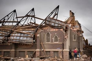 Zion Lutheran Church in Delmont, S.D., is demolished after an EF2 tornado roars through the town May 10, taking off the roof of the church but leaving Sunday-school children and teachers huddled in the basement unharmed. (LCMS/Erik M. Lunsford)