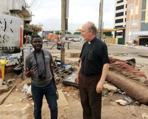 The Rev. Dr. David Erber, LCMS area director for West and Central Africa, (right), visits the site of a flood and explosion in Accra, Ghana, with Justice Oman, director of Lutheran Hour Ministries' Ghana office. (Evangelical Lutheran Church of Ghana/Jacob Fynn)