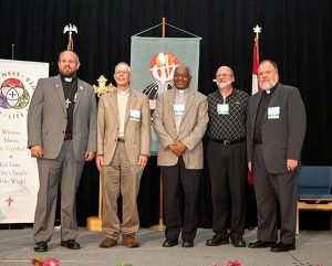 Newly elected English District officers pose for a group photo at the convention. From left are President-Elect Rev. Dr. Jamison Hardy, First Vice-President Rev. Ben Eder, Second Vice-President Rev. Zerit Yohannes, Third Vice-President Rev. Todd Arnold and Fourth Vice-President Rev. Robert Rogers. (Courtesy of LCMS English District)