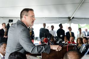 The Rev. Steven Schave, director of LCMS Urban & Inner City Mission and LCMS Church Planting, addresses some 300 people at the July 9 groundbreaking for the Community Empowerment Center of Ferguson. Schave said the Synod considers itself "blessed to be called a partner in the community of Ferguson — to help bring peace, and hope, and a brighter future for generations to come." (LCMS/Frank Kohn)