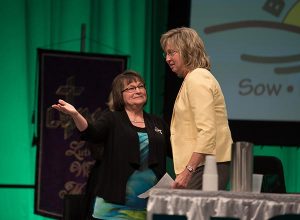 Outgoing LWML President Kay Kreklau, left, introduces Patti Ross to the convention following Ross’ election as president for the 2015-19 term. (Kris Bueltmann)