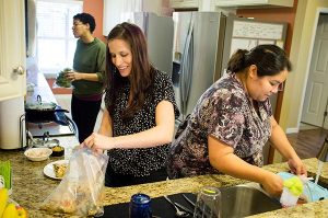 Resident Director Rachel Woolery (center) joins Jenny (left) and Lillian as they make lunch at Redeeming Life Maternity Home Feb. 12 in Sanford, Fla. The Christ-centered home of Redeeming Life Outreach Ministries, an LCMS Recognized Service Organization, provides a safe haven for single women with crisis pregnancies. (LCMS/Erik M. Lunsford)