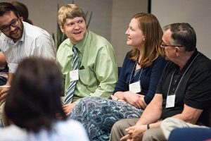 The Rev. Luke Wolters (second from left), pastor of Grace Lutheran Church in Wellsville, Mo., speaks during a panel discussion at the PALS Facilitator Training Conference in St. Louis. Wolters is joined by his wife, Jessica; the Rev. Matt Wood (far left), pastor of Concordia Lutheran Church in Maplewood, Mo.; and the Rev. Roger Sassaman, pastor of Peace Lutheran Church in Owensboro, Ky. (LCMS/Erik M. Lunsford)