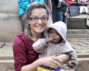 Dr. Maggie Karner holds a child during a 2010 Mercy Medical Team visit to Madagascar. Karner, director of LCMS Life and Health Ministries for 12 years, died Sept. 25 from brain cancer. (LCMS Health Ministry)