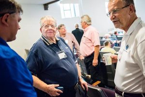 Conversing during a break at the 2015 National Disaster Response Conference in St. Louis are, from left, Joel Moritz, assistant to the president, Lutheran Church Charities (LCC); the Rev. William Wagner, emergency-services chaplain with the LCMS South Wisconsin District; and the Rev. Roger Pollock, congregational ambassador with LCC. (LCMS/Erik M. Lunsford)