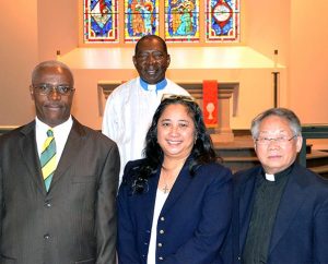 Among the eight Ethnic Immigrant Institute of Theology (EIIT) students receiving calls during a special chapel service Oct. 23 at Concordia Seminary, St. Louis, are, from left, Saint-Luc Charelus, Deaconess Norma Polk and Chong Toua Vang. Also pictured is EIIT Director Rev. Dr. John Loum. (Concordia Seminary)