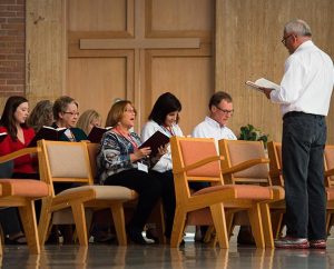 Dr. John D. Eckrich, founder of Grace Place Ministries, leads a prayer service at the Oct. 6-10, 2014, Grace Place retreat for deaconesses in St. Louis. (LCMS/Erik M. Lunsford)