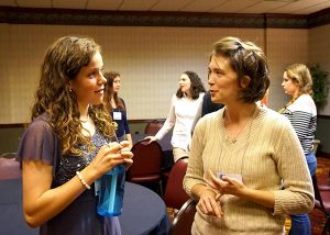 Rebekah Anderson, left, a high school student from St. Paul Park, Minn., talks with Cassandra Wilcoxen, a graduate student at the University of Illinois at Urbana-Champaign, during a gathering for young adults at the 2015 Lutherans For Life National Conference. (LCMS/Megan K. Mertz)