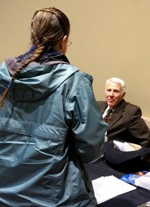 Col. John Eidsmoe, a pastor with the Association of Free Lutheran Congregations who also serves as professor of Law at the Oak Brook College of Law and Government Policy in Fresno, Calif., and professor of Apologetics at the Institute of Lutheran Theology in Brookings, S.D., talks with an attendee at the 2015 Lutherans For Life National Conference. (LCMS/Megan K. Mertz)