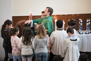 The Rev. Dr. Gottfried Martens baptizes new Christians after they renounced Islam on Sunday, Nov. 15, 2015, at the St. Marien Gemeinde, a SELK Lutheran church in Berlin-Steglitz, Germany. (LCMS/Erik M. Lunsford)