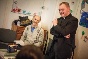 The Rev. Markus Fischer, pastor of the Evangelisch-Lutherische St. Trinitatisgemeinde, a SELK Lutheran church in Leipzig, Germany, leads a Bible study for Iranian and other refugees on Friday, Nov. 13, 2015, near the church in Leipzig. (LCMS/Erik M. Lunsford)