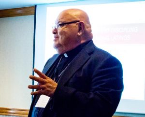 The Rev. Dr. Carlos Hernandez, director of Church and Community Engagement for the LCMS Office of National Mission, speaks during a session on Hispanic Ministry during the 2015 National Rural & Small Town Mission Conference Nov. 5-7 in Kansas City, Mo. Hernandez, whose responsibilities include Hispanic Ministry, spoke about the Synod’s Hispanic outreach efforts in rural areas across America. (LCMS/Roger Drinnon)
