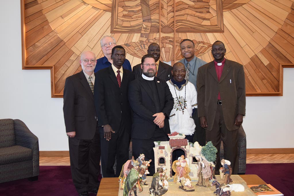 Pictured (left to right back): Dr. Curtis Peters, John Ater Deng, Rev. Larry Vogel, Abraham, Rev. Dr. Roosevelt Gray. Pictured (left to right front): Rev. Dr. Albert Collver, Dr. John Loum, Bishop Elijah Arok.