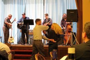 LCMS Eurasia Region Business Manager Richard Sovitzky and his wife, Sarah, dance to bluegrass music at the dinner party hosted by the LCMS Eurasia Region for the Feb. 12-14 Network of Young Lutheran Theologians conference near Prague. Playing the banjo, at left, is LCMS Eurasia Region Director Rev. James Krikava. (Craig Donofrio)