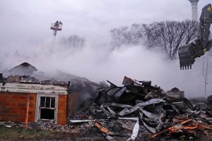 Smoke rises from the fire that was discovered just after 2 a.m. March 30 as daylight illuminates the damage to St. James Evangelical Lutheran Church in Northrop, Minn. (Courtesy of The Truman Tribune)