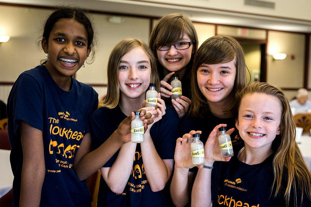 Christina Yepez, third from left, and classmates hold bottles of the glue they discovered doing an environmental project that earned an invitation to the White House Science Fair in Washington, D.C. Calling themselves the Blockheads, the budding scientists from South St. Louis County, Mo., discovered an innovative way to turn Styrofoam cups that clog landfills into a useful glue. (Joy Lamb)