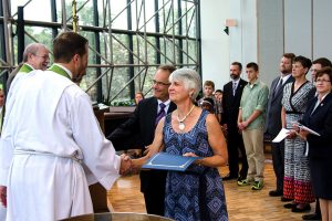 Dr. Martin and Marie Dicke, right, are congratulated by LCMS Office of International Mission staff during the June 24 Service of Sending for new overseas missionaries. The Dickes will serve as musicians/educators in Papua New Guinea. (LCMS/Frank Kohn)