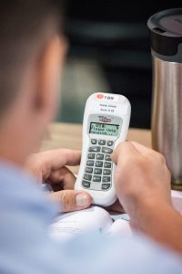 Delegate Corey Isaak works with the electronic voting system during the LCMS national convention in Milwaukee. (LCMS/Michael Schuermann)