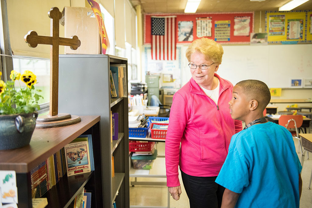 Teacher Nancy Spitzack talks with student Josiah Knox at Lutheran Special School & Education Services, located at Milwaukee Lutheran High School. (LCMS/Erik M. Lunsford) 