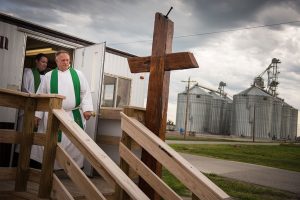 The Rev. Terry Makelin, pastor of St. John’s Lutheran Church, and the Rev. Michael Meyer, manager of LCMS Disaster Response, walk down the stairs of the temporary church office of St. John’s on June 16, 2015, as the new church building remained under construction a year after dual EF-4 tornadoes destroyed the church. (LCMS/Erik M. Lunsford)