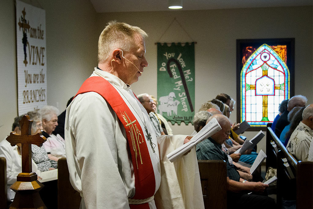 St. John’s Lutheran Church Pastor Rev. Terry Makelin conducts the liturgy during the Aug. 28 dedication of St. John’s new sanctuary, now that the rebuilding of the church is complete two years after twin tornadoes left only a slab of concrete in their wake. (LCMS/Frank Kohn)