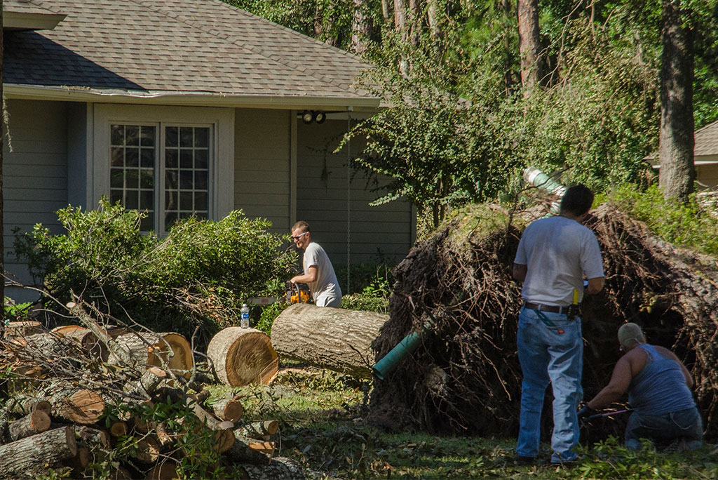 Local residents work to remove a downed tree from a South Carolina home in the aftermath of Hurricane Matthew. North Carolina and South Carolina took on torrents of rain and fierce winds as the hurricane moved up the southeastern U.S. coastline. (LCMS Communications/Al Dowbnia)