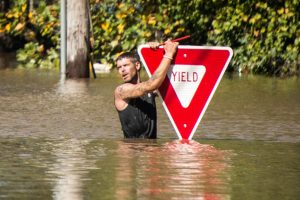 hurricane-matthew-man-and-yield-sign-1024x684