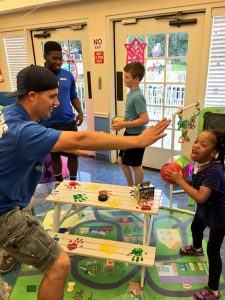 Graham Barber, director of Youth Ministries at Our Savior Lutheran Church and School in St. Petersburg, Fla., plays basketball with a resident at Sabal Palms, a local pediatric nursing home. (Cassie Moore/Our Savior Lutheran Church and School)