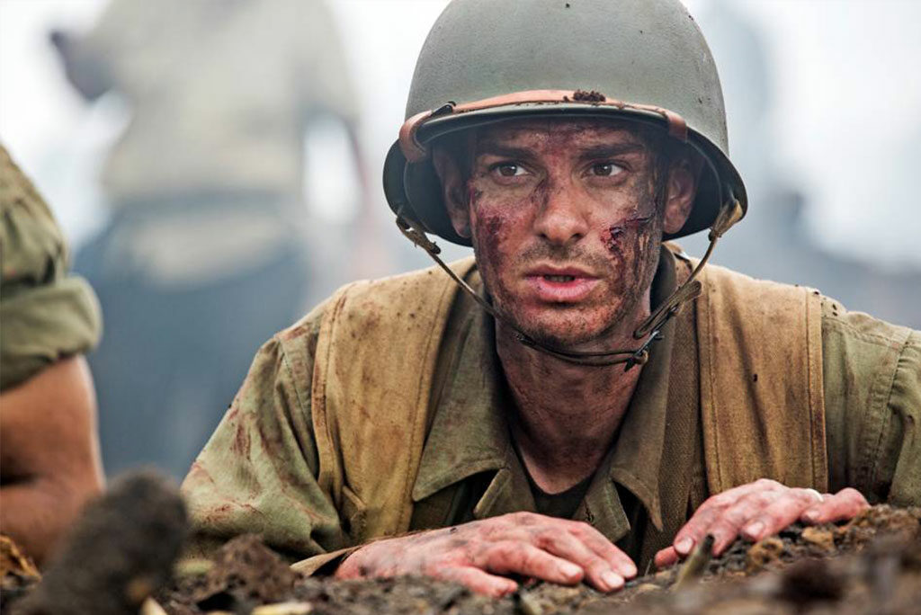 Mel Gibson's gory new war film tells the true story of Private First Class Desmond Doss — in a strong performance by Andrew Garfield — a World War II American Army medic and conscientious objector who wanted to save lives, not take them.