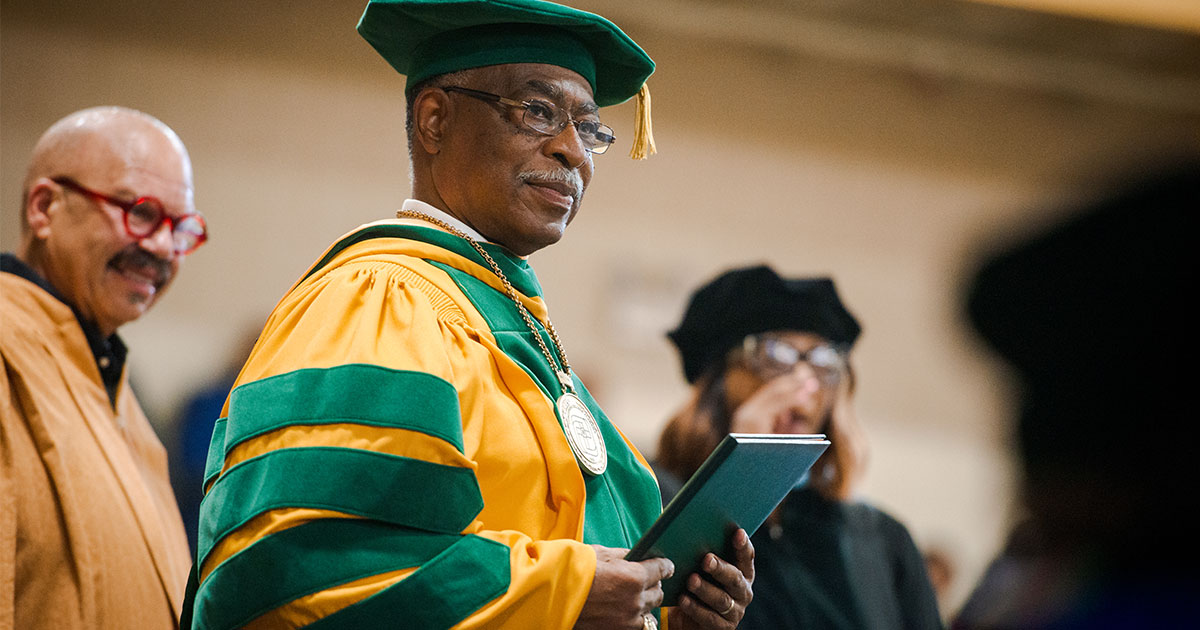 Dr. James Lyons, the transitional president at Concordia College Alabama, extends diplomas during the college’s 92nd and final graduation ceremony on Saturday, April 28, in Selma, Ala. (LCMS/Erik M. Lunsford)